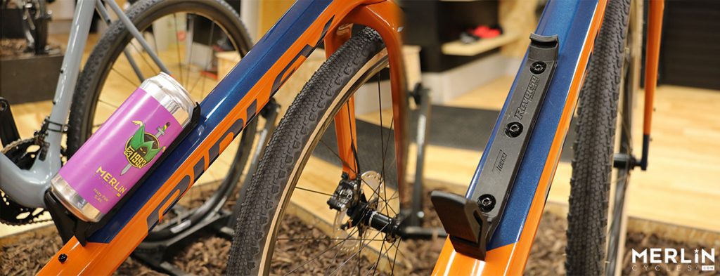 Bicycle fitted with a bottle cage that holds a beer can safe and secure